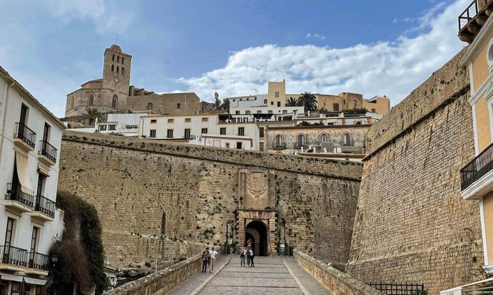 Ibiza Castle in the background among Ibiza Town with the gates in the foreground
