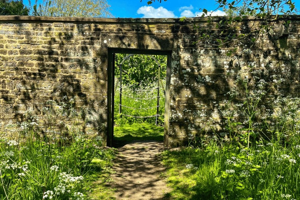 Archway in the wall at Canons Ashby Gardens